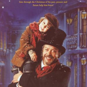 Dominic Scott Kay and Tim Curry in a publicity photo for A Christmas Carol