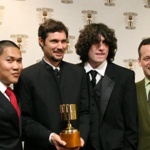 Dante Basco (l), Jack De Sena (3rd from l), Dee Bradley Baker (r) present the Production Artist award to John Clark.