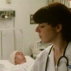 Joanna Jeffrees as Nurse Angell in 'Bribery & Corruption' alongside Tim Woodwood.
