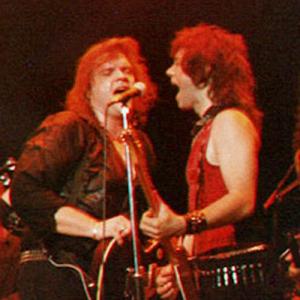 Alan Merrill right with Meat Loaf live at Wembley London England 1987