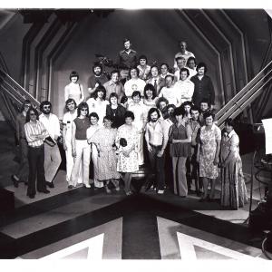Arrows show cast and crew after filming weekly TV series one Arrows lead singer Alan Merrill in white Kimono top
