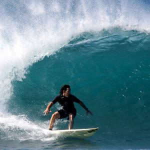 John Fortson surfing Backyard Sunset, North Shore, Hawaii