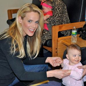 Heidi Albertsen, goodwill ambassador of the Lower Eastside Service Center, visits with an infant at Su Casa, a residential treatment facility in New York City that benefits opiate-addicted pregnant women and children, 2012.