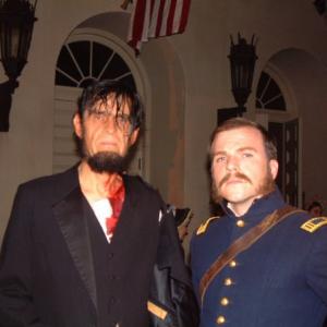 Cullen Moss as Senior Officer Carlisle on the set of The Conspirator with slain President Lincoln