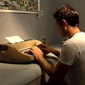 Steve (Peter C. Capella) is always at his typewriter in Never Among Friends (2002)