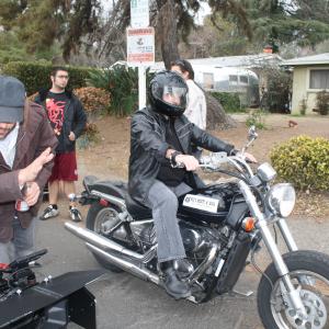 On the set of Buddy Hutchins showing Director Jared Cohn left and Sam Osman on the Motorcycle as Wolf the Bounty Hunter