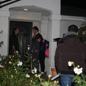 Sam Osman left and Jamie Kennedy right at the front door of the house getting ready for a Film Scene on the set of Buddy Hutchins Behind the Camera are Cinematographer Giorgio Daveed left and Film Director Jared Cohn right