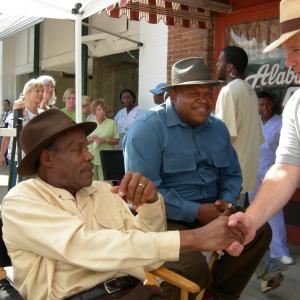 On Location. Honeydripper. 2006. Key tallent often takes note of RTMS efforts to create safe working conditions. Danny Glove and Keb Mo visit with Art after a long hot day of production work.