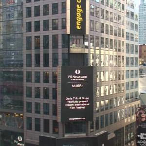 The photo of Bruno Pischiutta and Producer Daria Trifu presenting the Brasov International Film Festival & Market is featured in Times Square, New York City