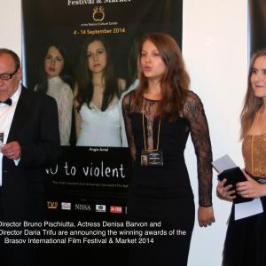Bruno Pischiutta Actress Denisa Barvon and Producer Daria Trifu handout the Awards at the 2014 Brasov International Film Festival  Market wwwbrasovfilmfestivalcom the most important and renowned nonviolent film festival in the world