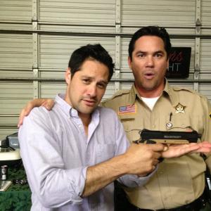 Seth Menachem and Dean Cain playing on the set of Defending Santa