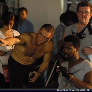 WriterDirectorStar JeanClaude Van Damme gives instructions to costar Josef Cannon in Bangkok Thailand on the set of feature film The Eagle Path