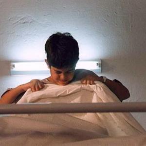 Still of short film No 19  No 19 Thiago Carvalho tries to shred a blanket with his bare hands