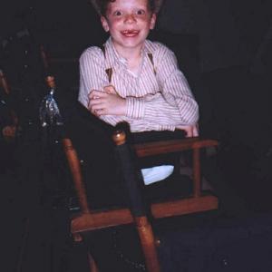 Cameron Monaghan taking a break in a director's chair