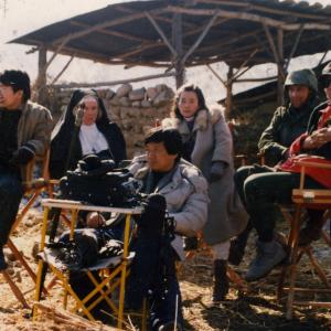 Dennis Christen Gary Wood Greta Blackburn and Eun Kyong Soe on the set of SOLDIERS OF INNOCENCE 1989