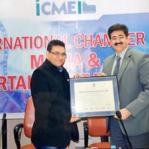 Sandeep Marwah Chairman of Marwah Studio and Media Group of companies on special occasion giving honorary membership of International Chamber of Media  Entertainment Industry to Raaj Rahhi for his contribution in International Production  Dis