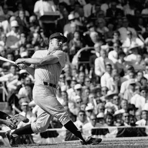 Roger Maris of the New York Yankees hits his 61st home run on October 1, 1961. Roger was and is my only sports idol. The catcher is Boston Redsox's Russ Nixon.