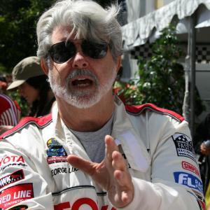 George Lucas talks shop at the LB Toyota Grand Prix Celebrity Pro Race. Sheila House field producing news package for CNN affiliate.