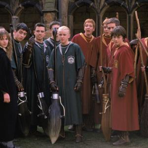 Hermione Granger (EMMA WATSON, left) joins the Quidditch players including Draco Malfoy (TOM FELTON, center) and Harry Potter (DANIEL RADCLIFFE).