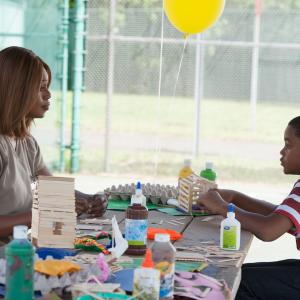 Still of Laverne Cox and Michael Rainey Jr in Orange Is the New Black 2013