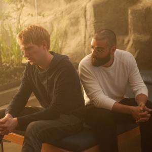 Still of Oscar Isaac and Domhnall Gleeson in Ex Machina 2015