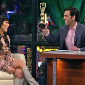 Talk show host Alex Cambert presenting Kim Kardashian with the Latina Booty Award aks The J Lo on Mas Vale Tarde with Alex Cambert