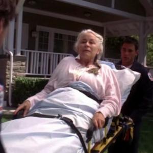 George Watson as Aunt Lily's stretcher attendant (left) on Desperate Housewives Starring Terrry Hatcher, Eva Longoria Parker, Marcia Cross, Dana Delany, Kyle MacLachlan, Nathan Fillion
