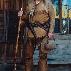 Bruce Dickinson as Big Dan in the PAX TV Series Ponderosa Bruce has a traditional mountain man costume and is outfitted with 44 Colt Walker Bowie Knife and 50cal Kentucky Long Rifle