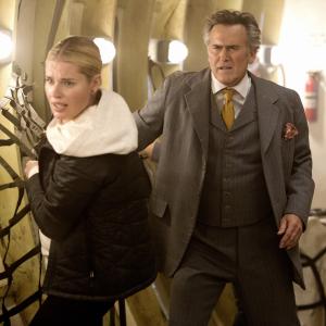 Still of Rebecca Romijn and Bruce Campbell in The Librarians 2014