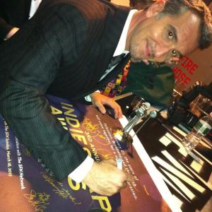 Signing the Indie Soap Awards Winners Poster for receiving BEST ACTORComedy in Vampire Mob