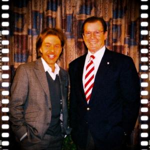 David Giammarco and Sir Roger Moore sharing a laugh in London England