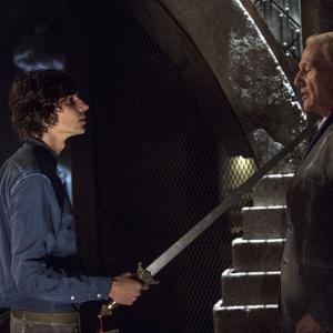 Still of Raymond J Barry and Devon Bostick in The 100 2014