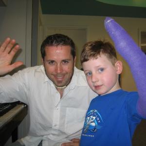 Mateo Messina playing piano with a patient at Seattle Children's Hospital.