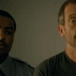 Still photo of Elijah Eugene Long and Hugh Laurie filming HOUSE