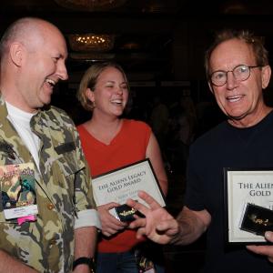 Producer Harry Harris left presents Lance Henriksen and Carrie Kutcher with their Aliens Legacy Gold Awards on behalf of Aliens fans worldwide
