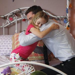 Still of Barry Sloane and Kylie Rogers in The Whispers 2015