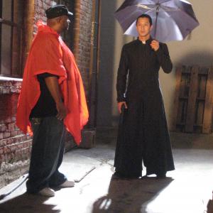 Director Ben Ramsey with actor Will Yun Lee on set of Another Lonely Road music video Priest costume designed by Hazel Yuan