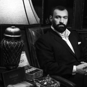 Oleg Prudius starring in a cigar launch as the most interesting man in the world