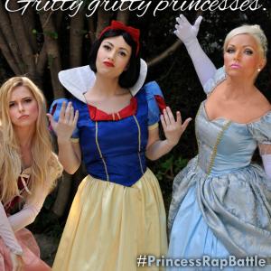Whitney Avalon center plays a tough Snow White in PRINCESS RAP BATTLE which she also wrote and produced With Briana White Aurora and Brittany Jo Gaylord Cinderella