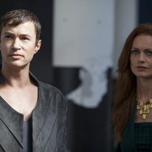 Still of Tom Wisdom and Rosalind Halstead in Dominion (2014)