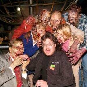 Scott Essman being devoured by makeup artist Rob Burman's zombies at the October 23, 2004 DVD premiere of Dawn of the Dead at Universal City