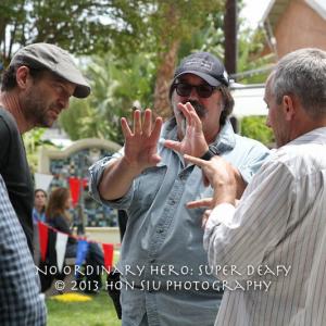 Troy Kotsur (Director with black t shirt) discuss with his DOP (Jeff Gatemans) through with interpreter,( James Foster) 2013