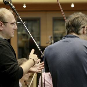 Composer Kerry Muzzey working with conductor Andrew Skeet and the Chamber Orchestra of London at AIR Studios May 22 2014