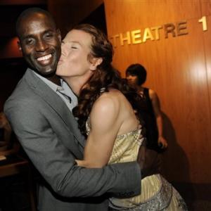 Tanna Frederick Giving Leading Man Lanre Idewu a Kiss at Premiere of Irene in Time