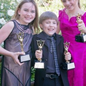Alix Kermes Luke Spill and Madison Ford hold their trophies from the 2005 26th Annual Young Artist Awards