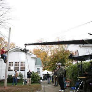 Mark Freiburger and cinematographer Rob Givens on right with actors Ted Levine and Ian Colletti in background on the set of JIMMY