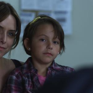 Still of Jenny Mollen and Ty Simpkins in Extracted (2012)