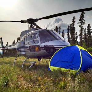 Thomas C. Miller changing a lens in Alaska. Job: Aerial America Alaska