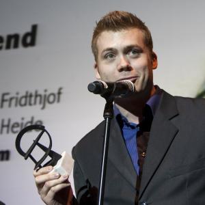 Rasmus Heide receiving the Robert Audience Award for Take the Trash