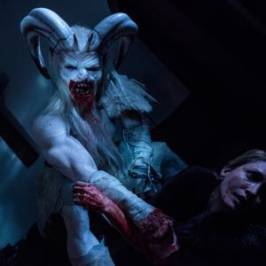 Still of Michelle Nolden and Rob Archer in A Christmas Horror Story 2015